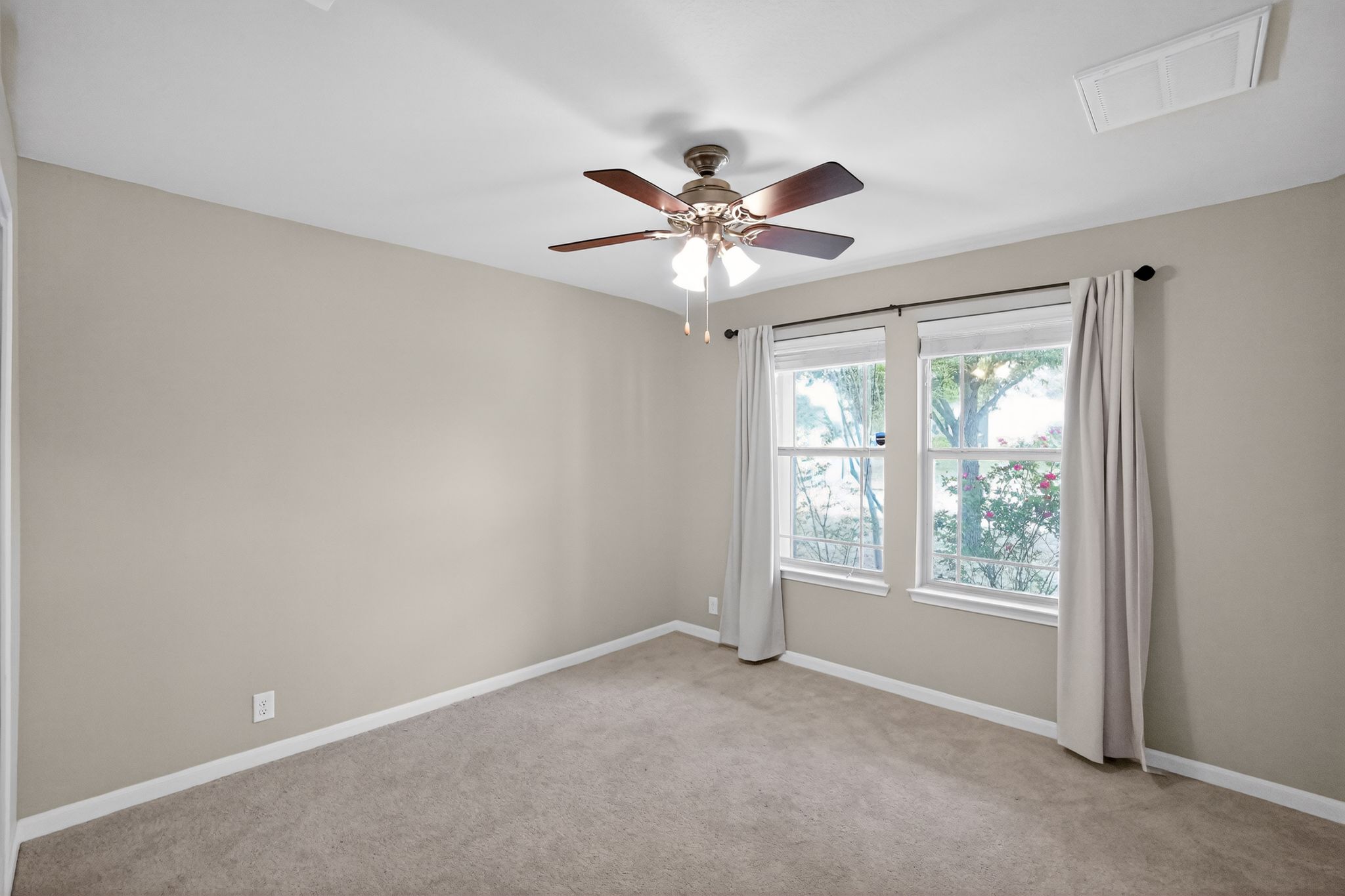 1313 April Meadows Loop Georgetown, TX 78626 - Photo 4 of 21 Empty room with a ceiling fan and light colored carpet