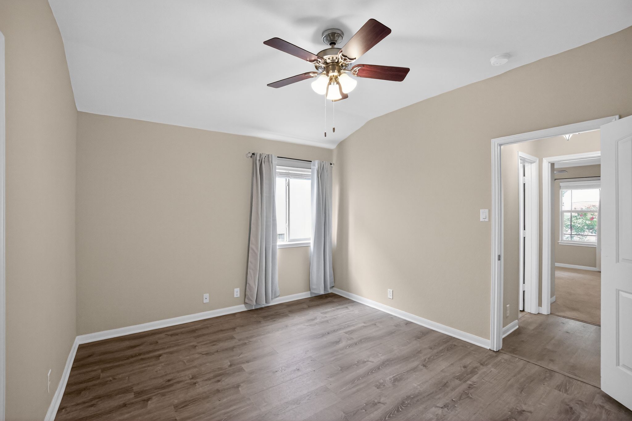 1313 April Meadows Loop Georgetown, TX 78626 - Photo 5 of 21 Spare room featuring lofted ceiling, dark wood-style flooring, and ceiling fan