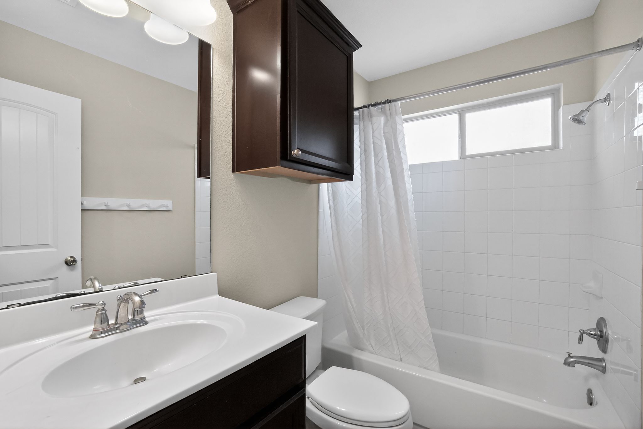 1313 April Meadows Loop Georgetown, TX 78626 - Photo 10 of 21 Full bath featuring vanity and shower / bathtub combination with curtain