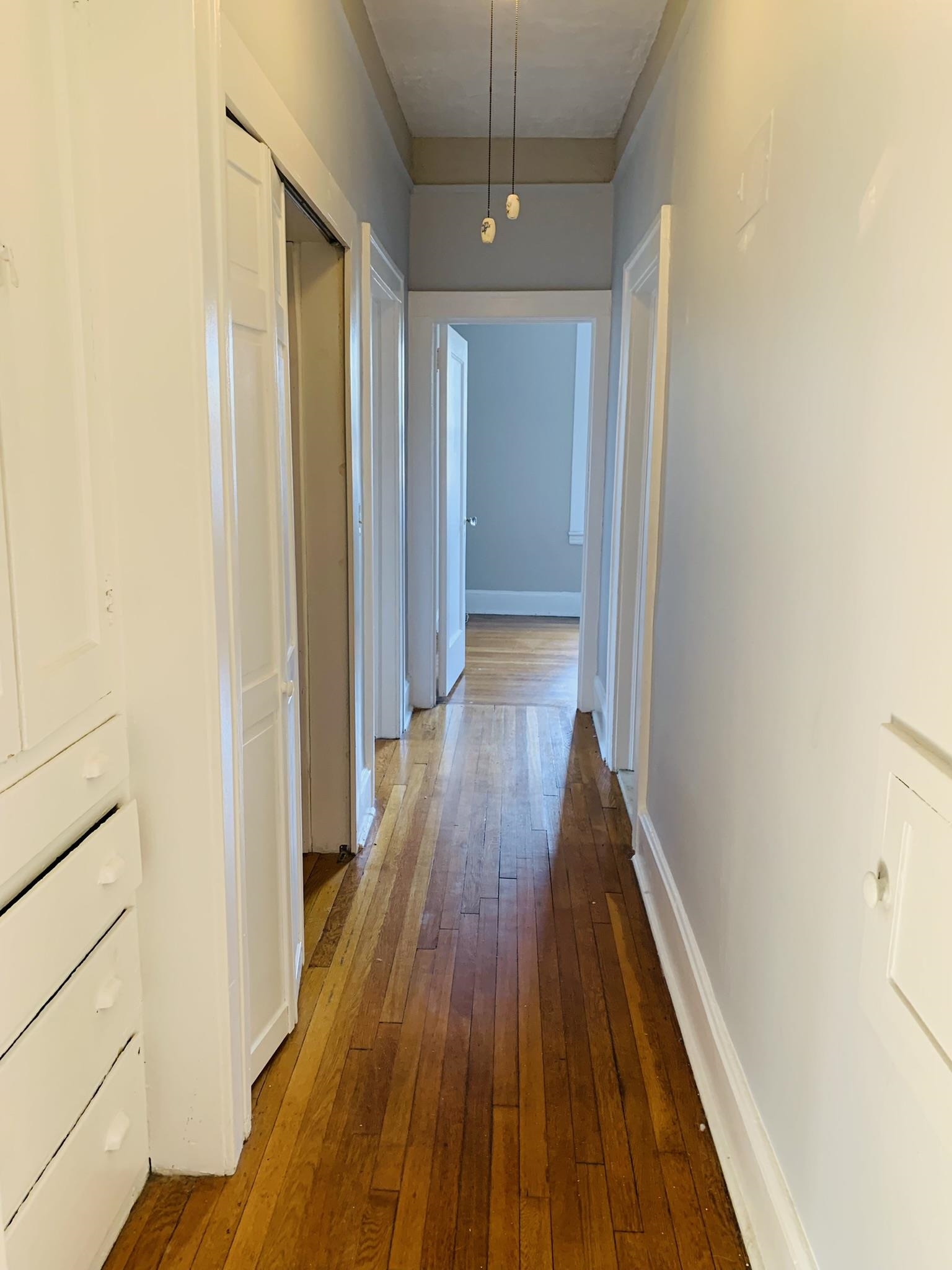 86 West 34th Street, Unit 2 Bayonne, NJ 07002 - Photo 13 of 14 a view of a hallway with wooden floor