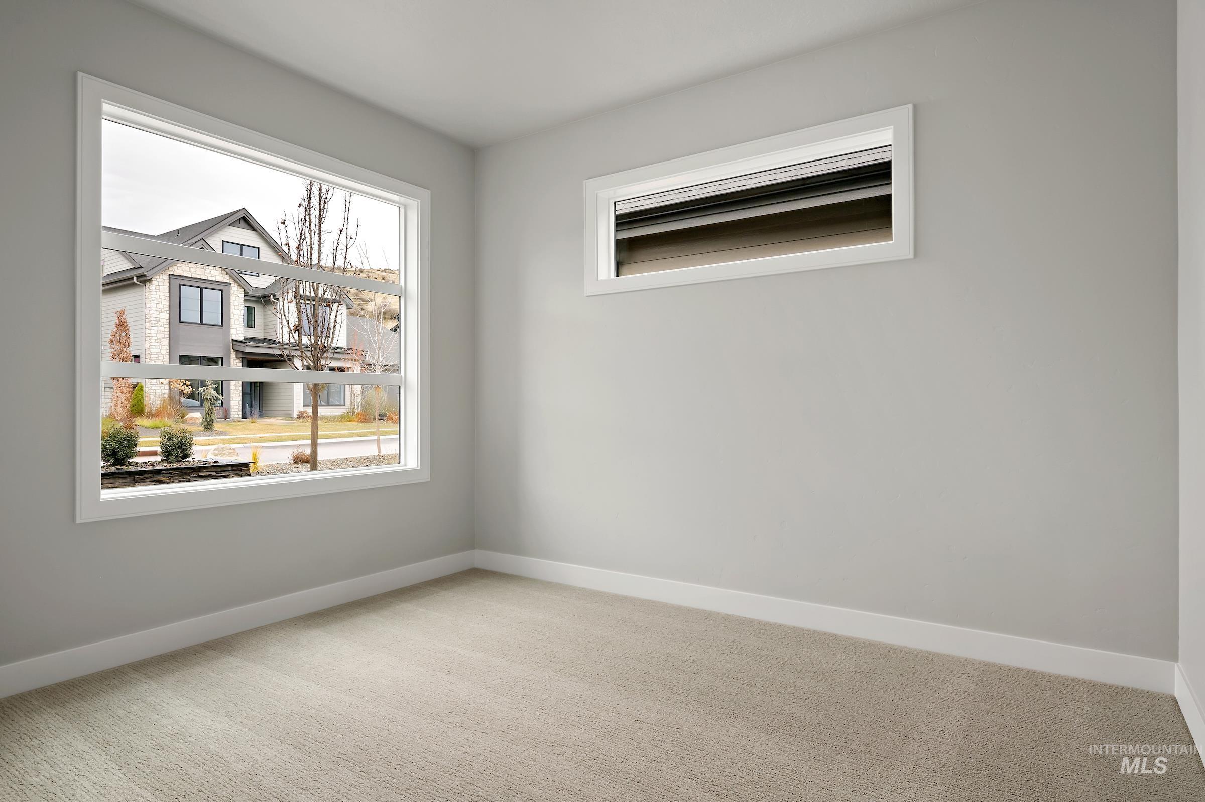 11725 North Rabbitbrush Way Boise, ID 83714 - Photo 12 of 36 Carpeted empty room featuring baseboards