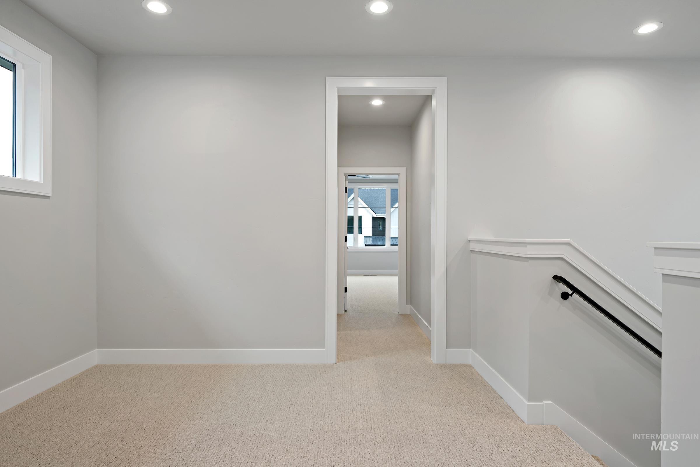 11725 North Rabbitbrush Way Boise, ID 83714 - Photo 22 of 36 Hallway featuring an upstairs landing, recessed lighting, and light carpet