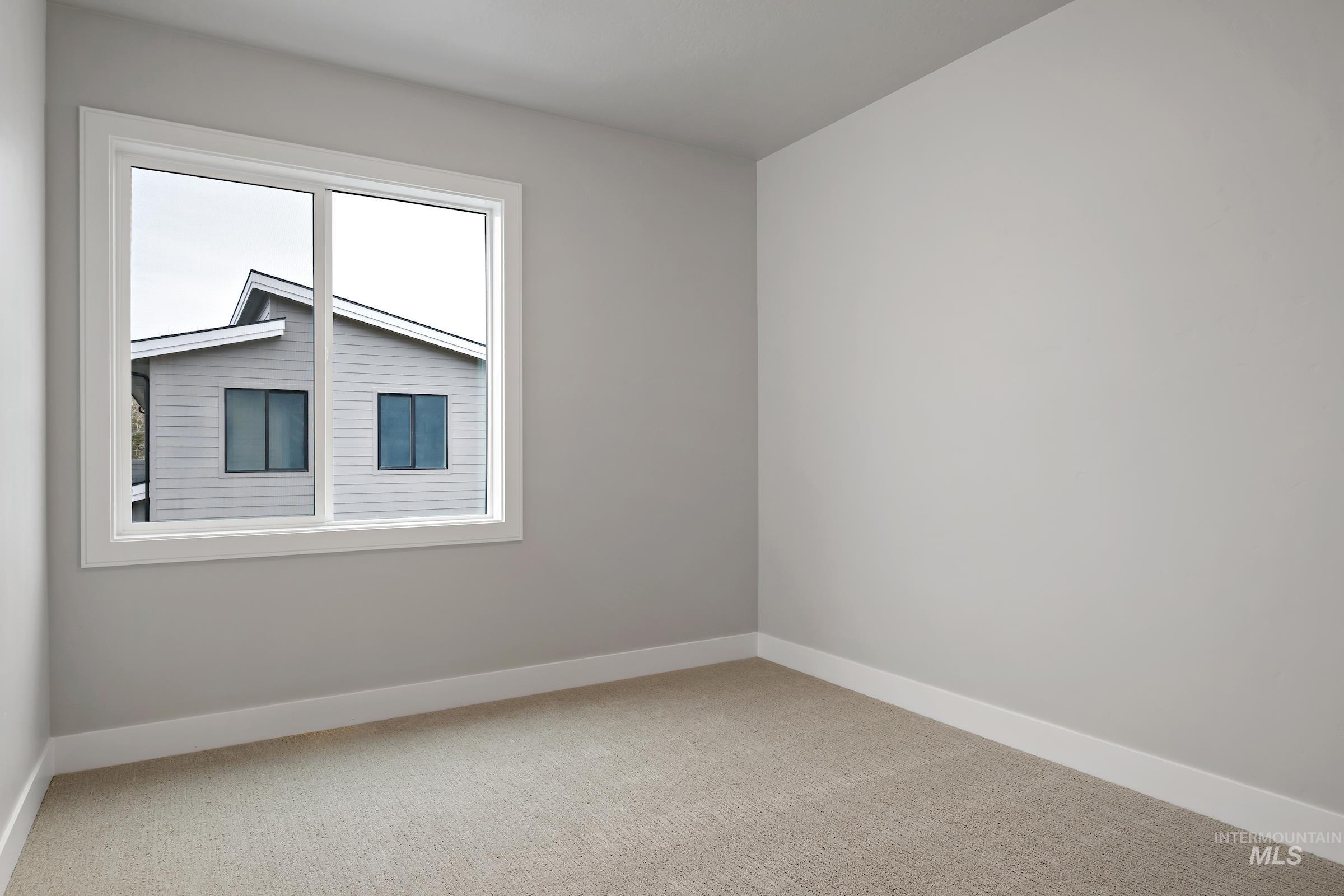 11725 North Rabbitbrush Way Boise, ID 83714 - Photo 28 of 36 Spare room featuring baseboards and light colored carpet
