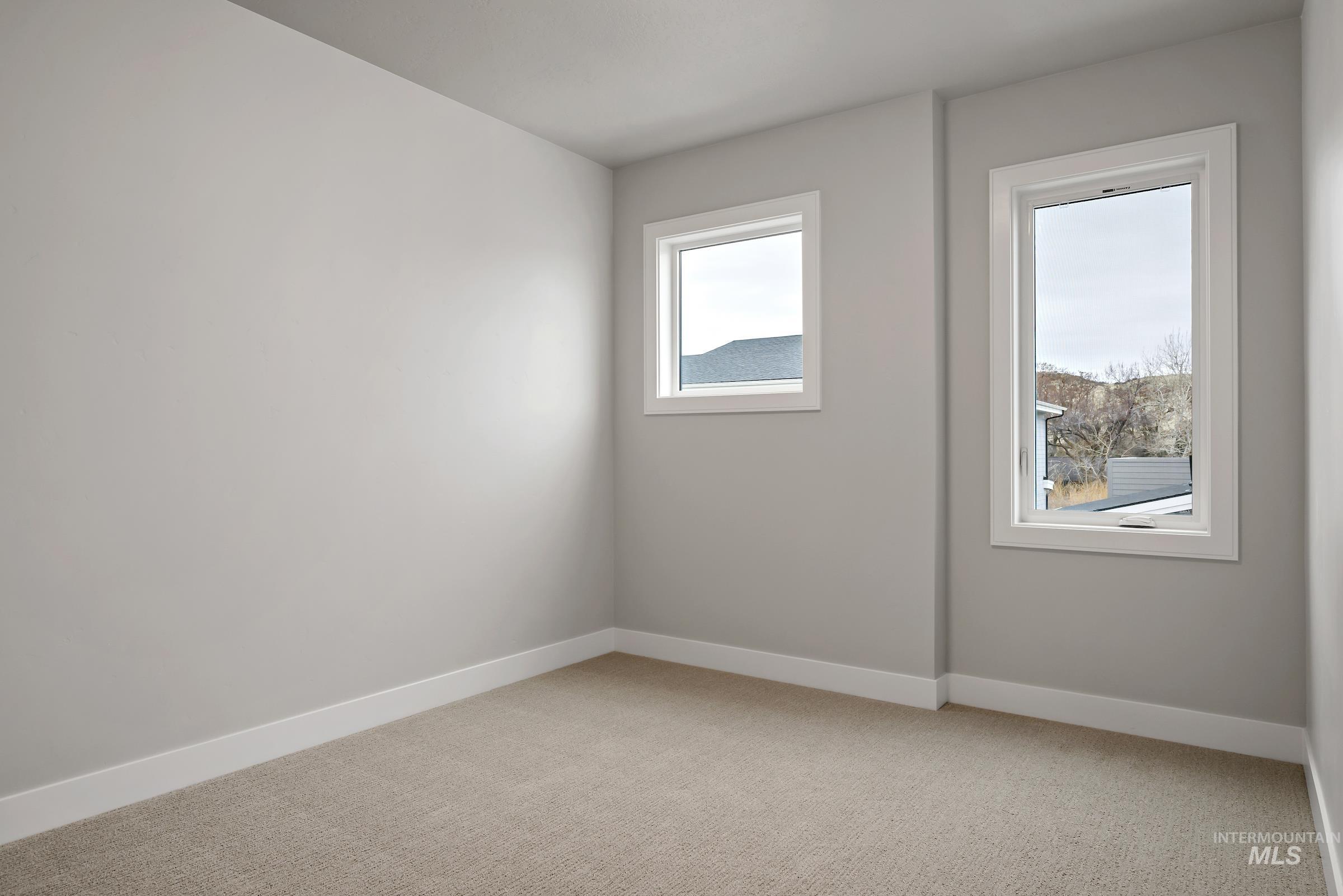 11725 North Rabbitbrush Way Boise, ID 83714 - Photo 29 of 36 Spare room featuring baseboards and light carpet