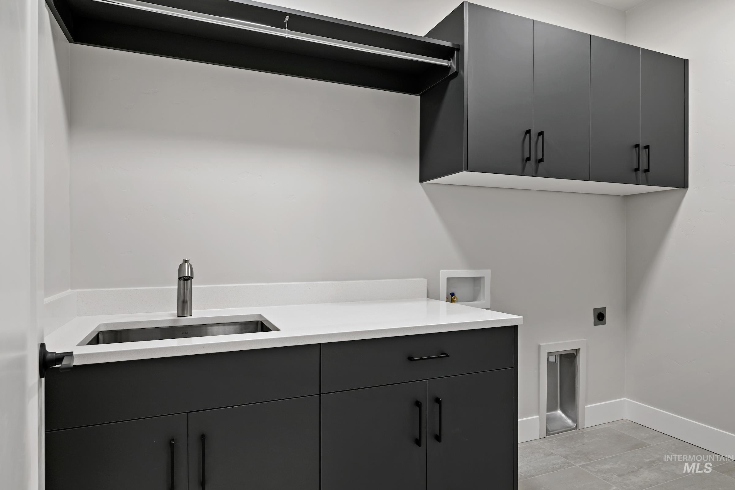 11725 North Rabbitbrush Way Boise, ID 83714 - Photo 30 of 36 Laundry room with cabinet space, hookup for a washing machine, and hookup for an electric dryer