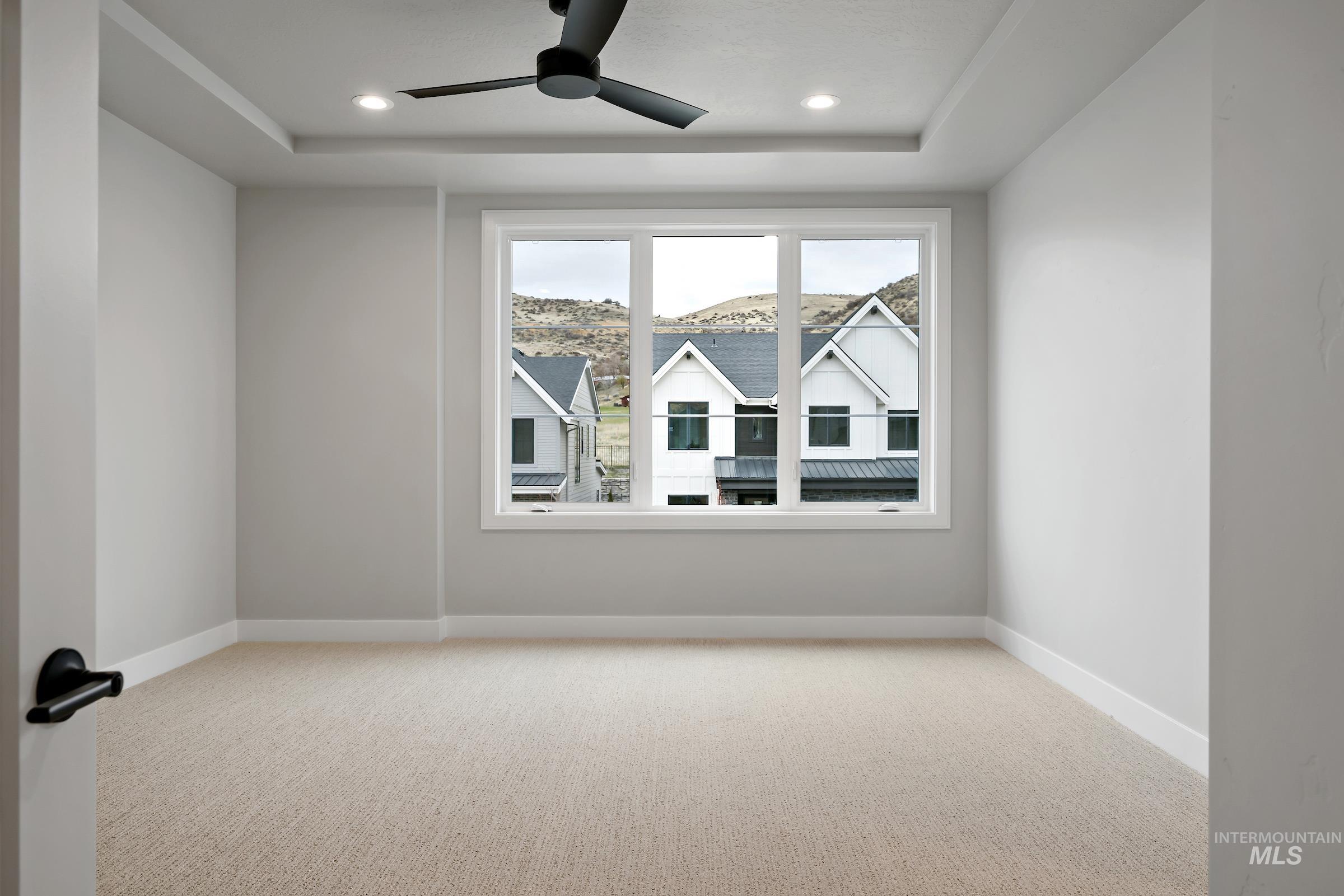 11725 North Rabbitbrush Way Boise, ID 83714 - Photo 31 of 36 Empty room featuring carpet, a ceiling fan, and recessed lighting