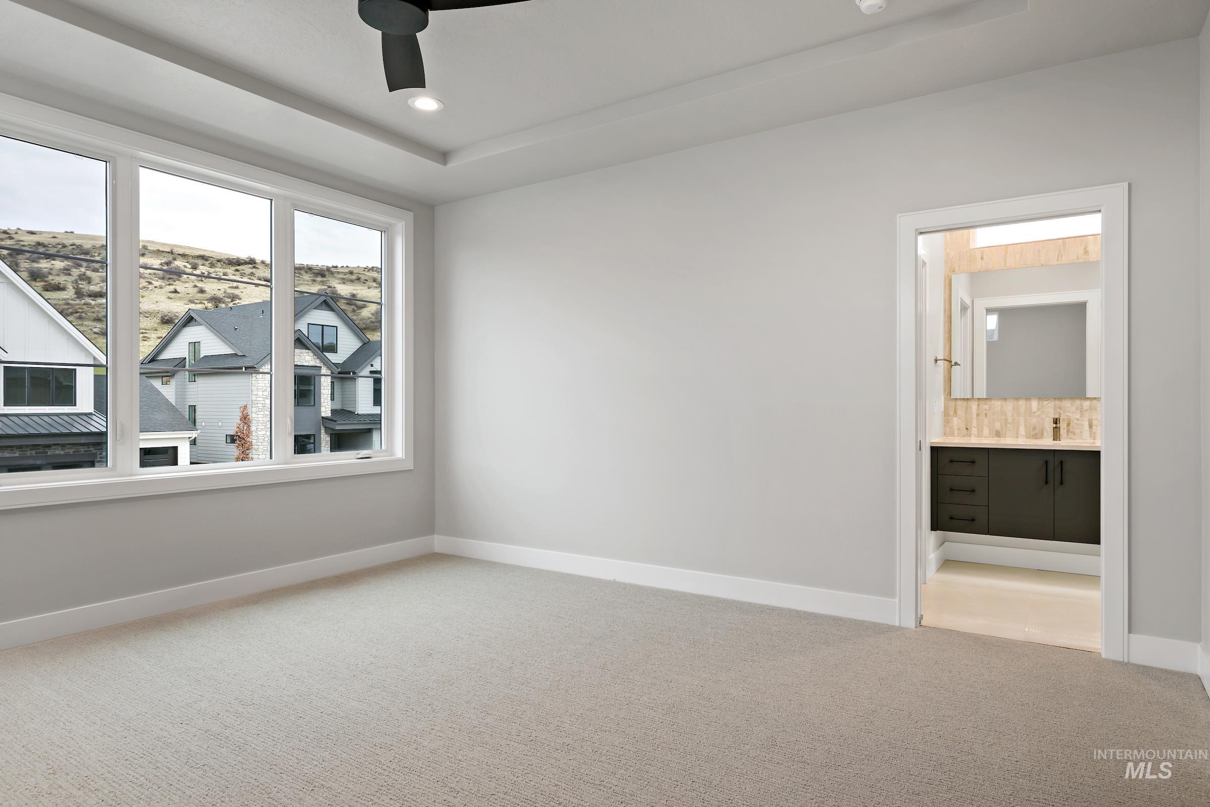 11725 North Rabbitbrush Way Boise, ID 83714 - Photo 32 of 36 Empty room featuring carpet floors, a ceiling fan, and recessed lighting