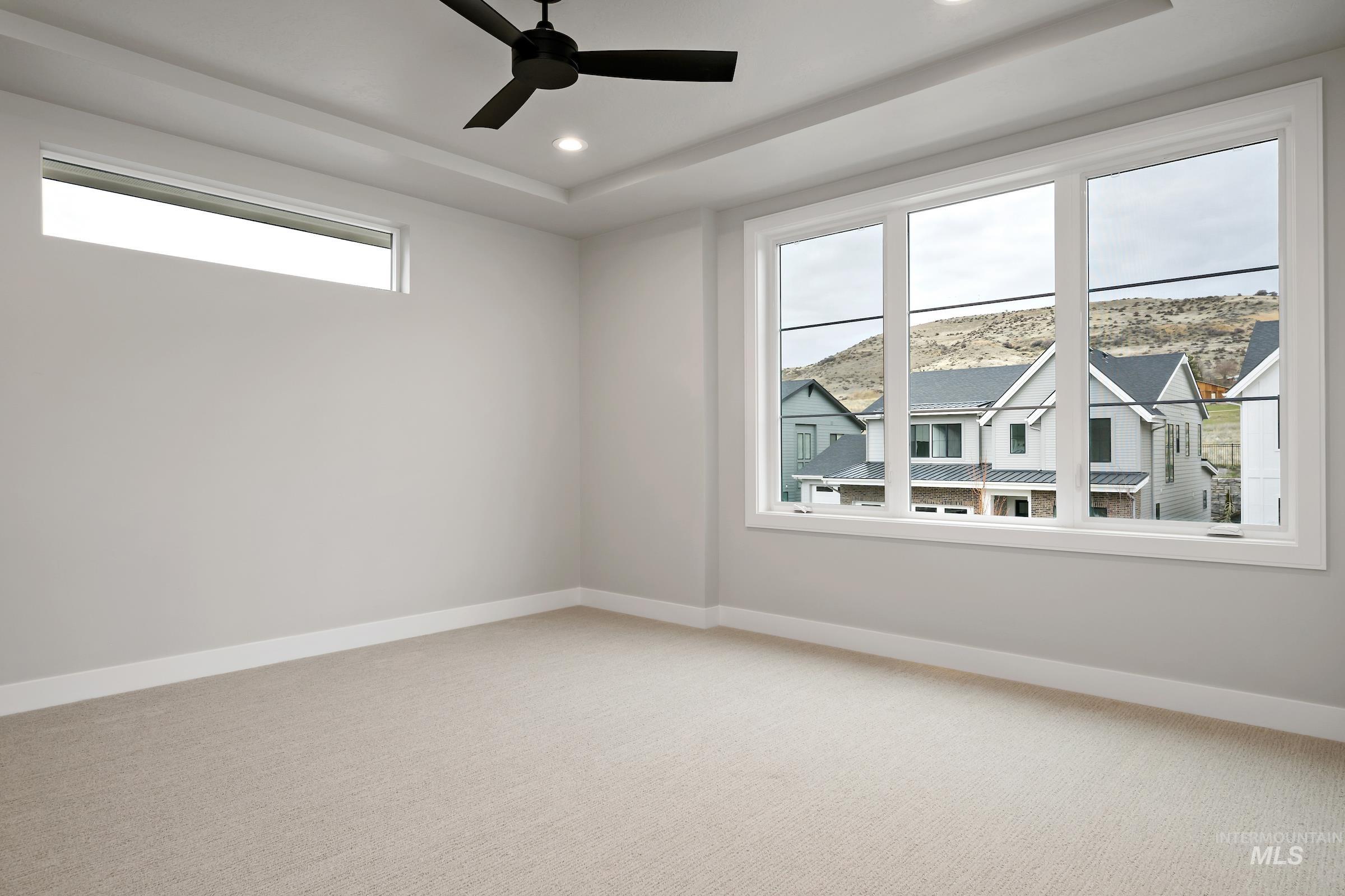 11725 North Rabbitbrush Way Boise, ID 83714 - Photo 33 of 36 Carpeted empty room featuring recessed lighting and ceiling fan