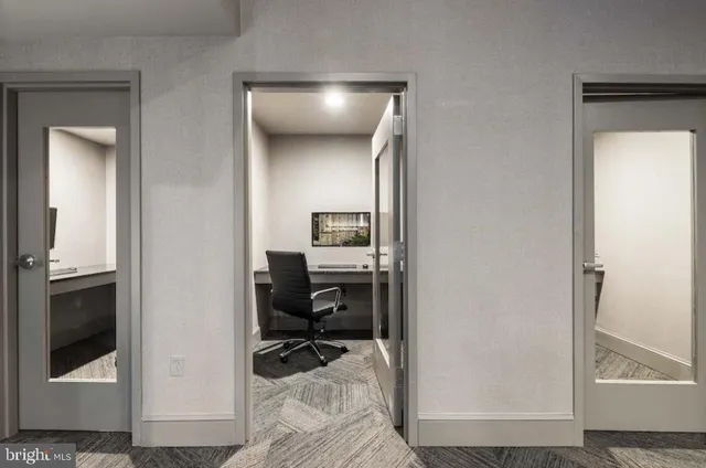 a bedroom with a bed and a mirror