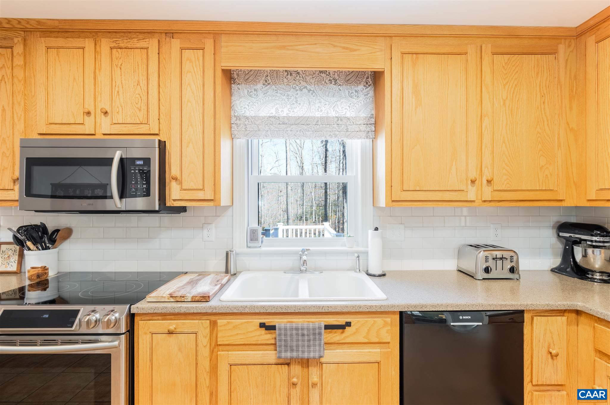 2640 Thrush Road Charlottesville, VA 22901 - Photo 12 of 42 a kitchen with stainless steel appliances granite countertop a sink and a microwave