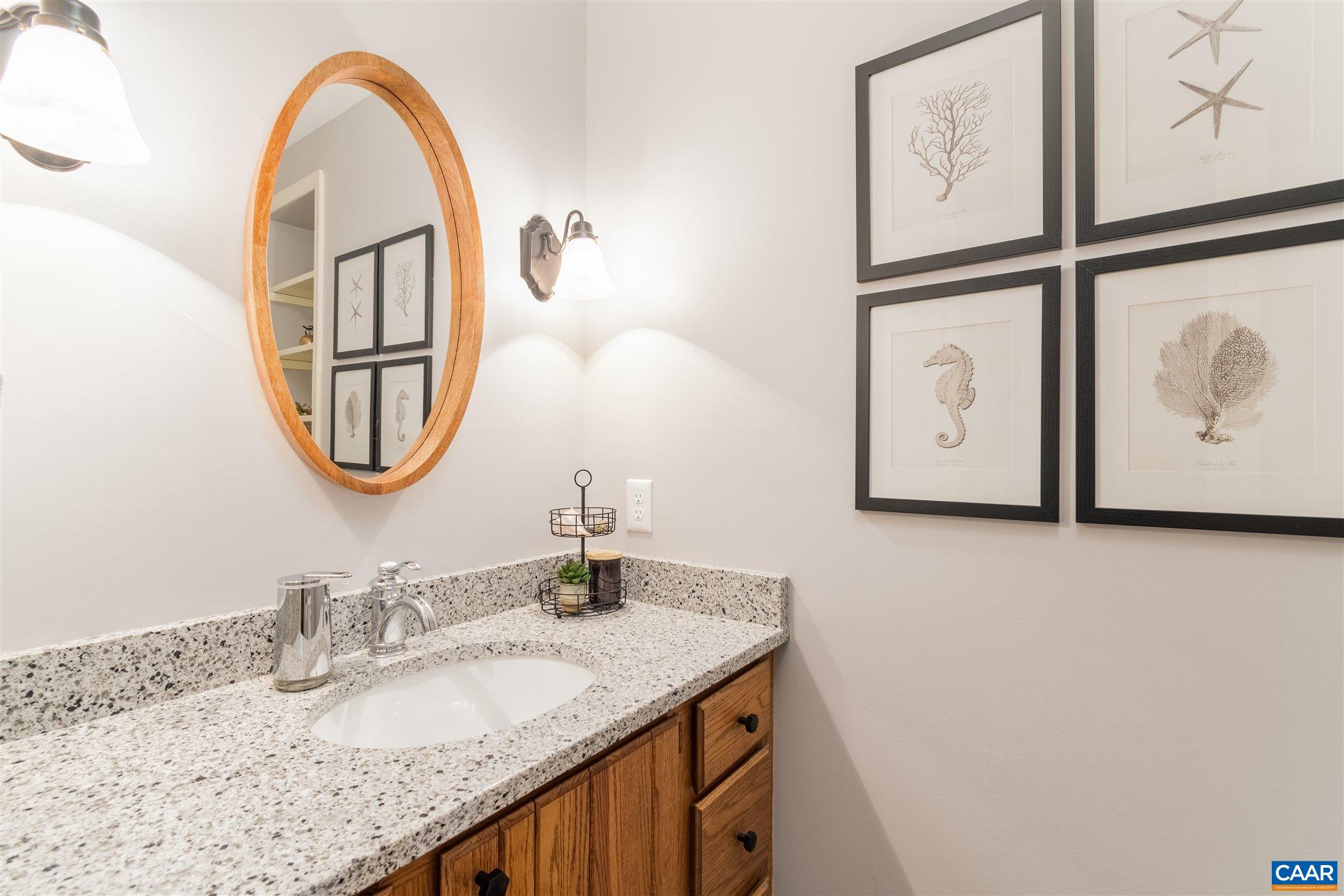 2640 Thrush Road Charlottesville, VA 22901 - Photo 14 of 42 a bathroom with a granite countertop double vanity and a mirror