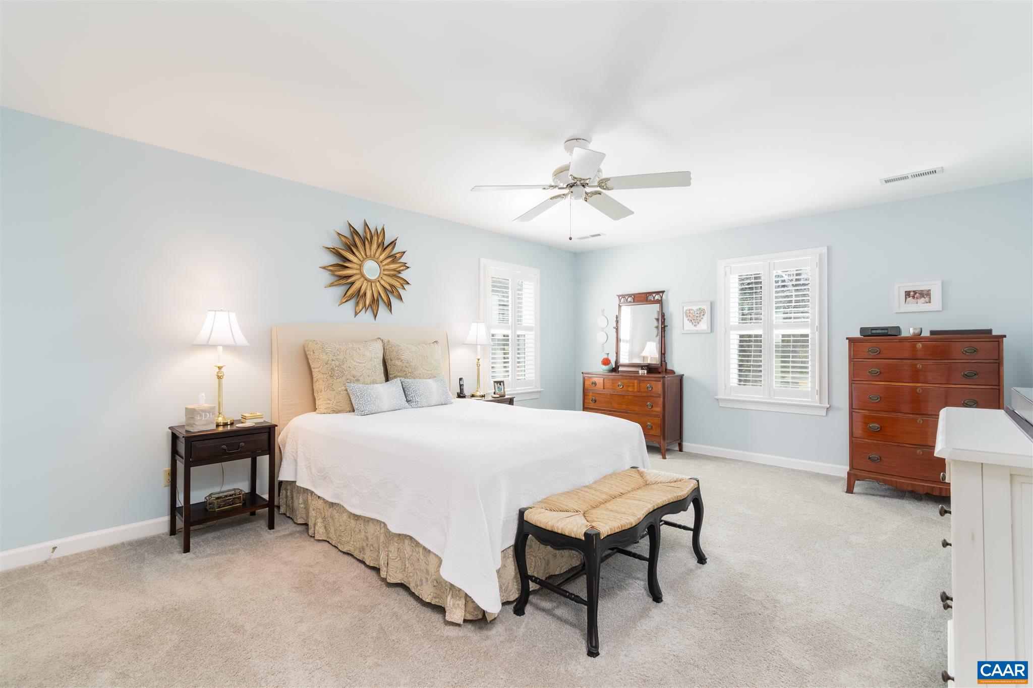 2640 Thrush Road Charlottesville, VA 22901 - Photo 18 of 42 a spacious bedroom with a bed and a chandelier