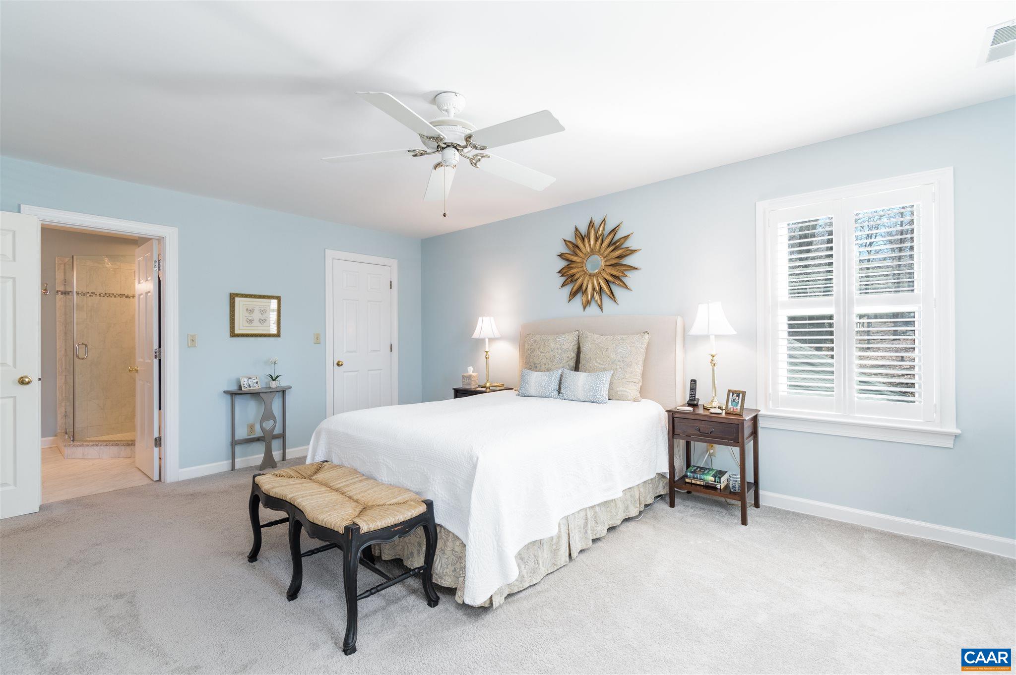 2640 Thrush Road Charlottesville, VA 22901 - Photo 19 of 42 a bedroom with a bed and a table in it
