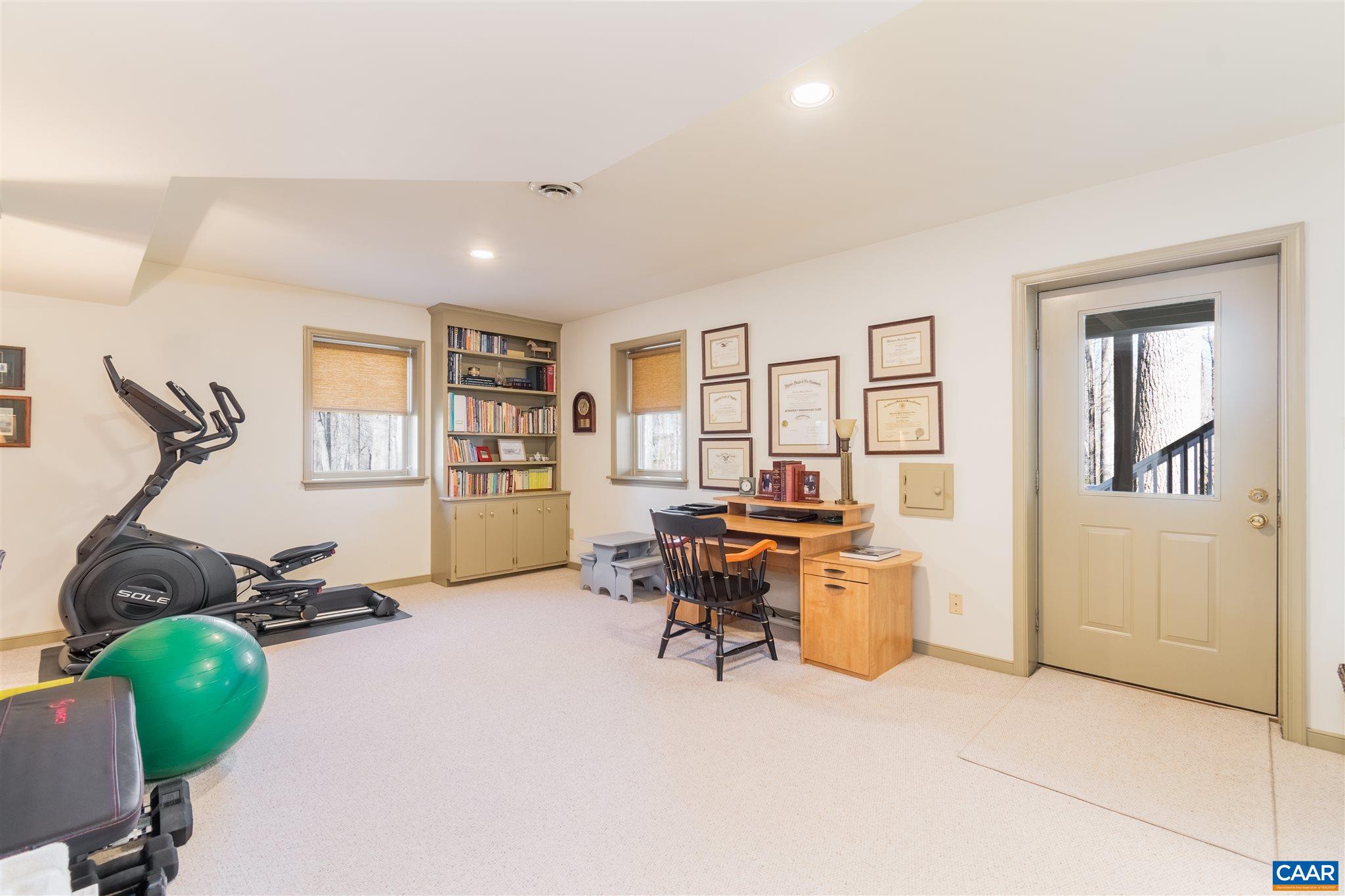 2640 Thrush Road Charlottesville, VA 22901 - Photo 35 of 42 a living room with furniture gym equipment and a window
