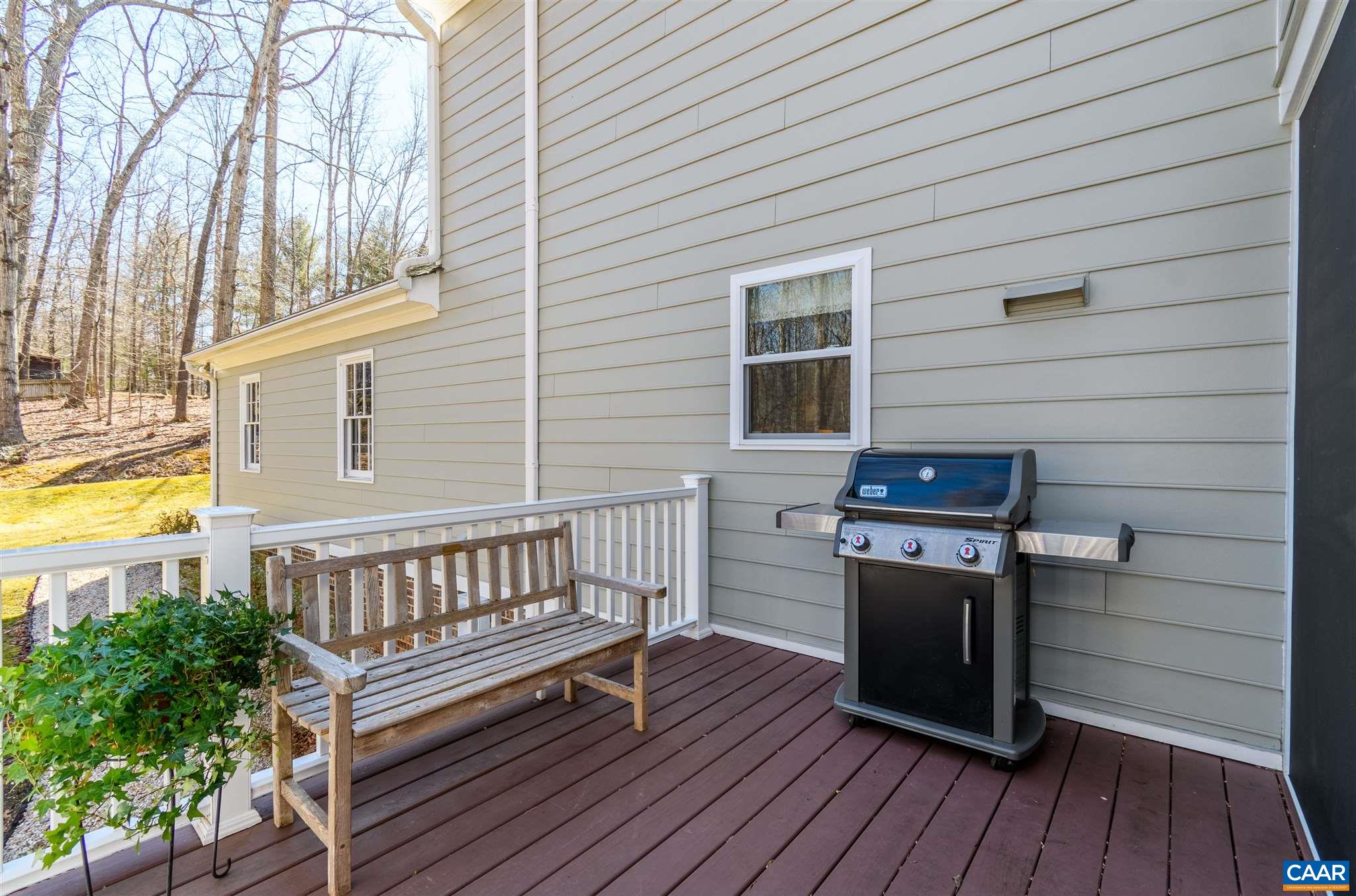 2640 Thrush Road Charlottesville, VA 22901 - Photo 39 of 42 a view of a deck with wooden floor and fence next to a yard