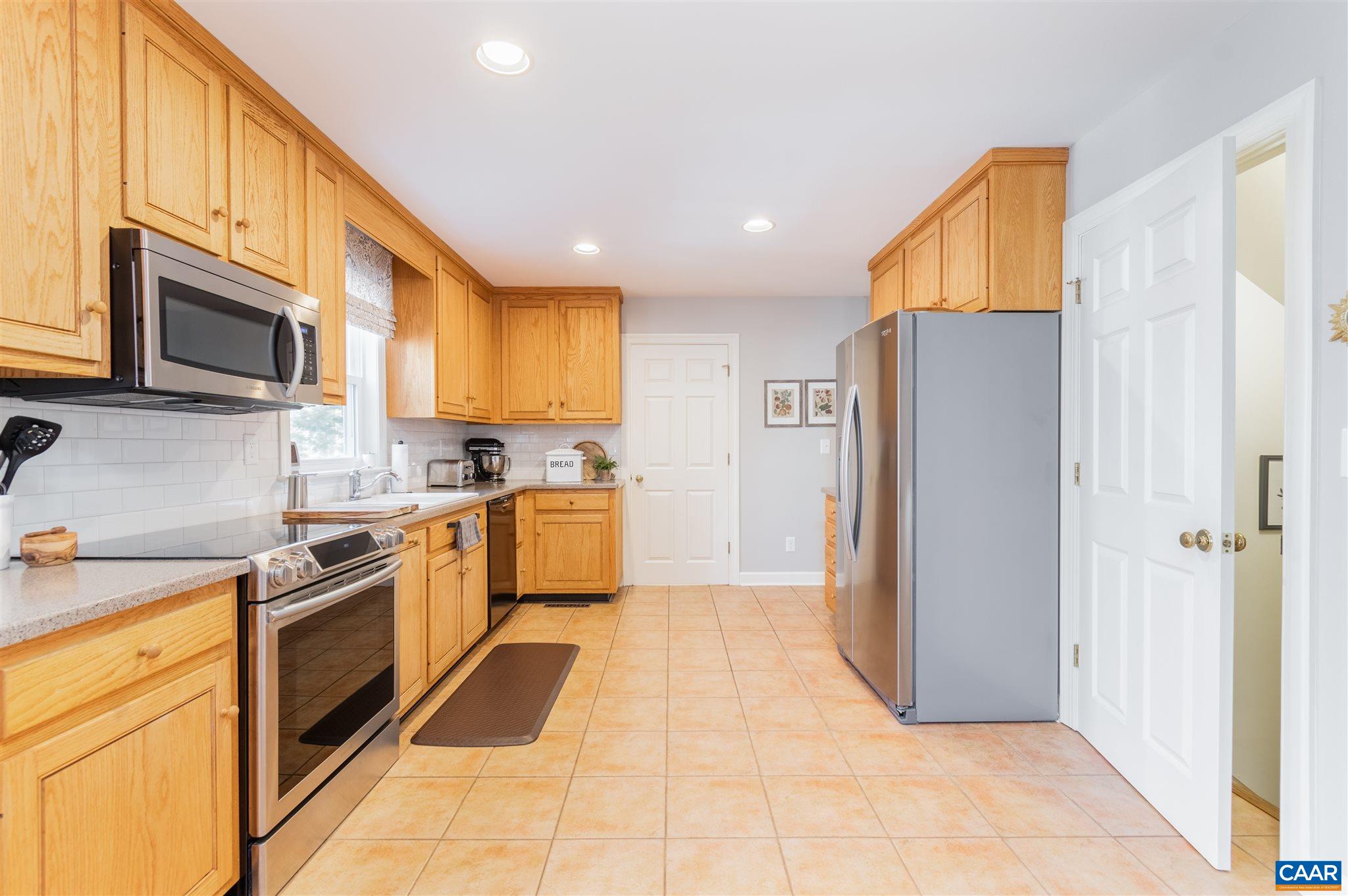 2640 Thrush Road Charlottesville, VA 22901 - Photo 8 of 42 a kitchen with a refrigerator sink and microwave