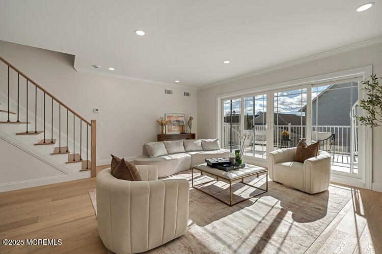 24 Surf Street Sea Bright, NJ 07760 - Photo 11 of 47 a living room with furniture and a table