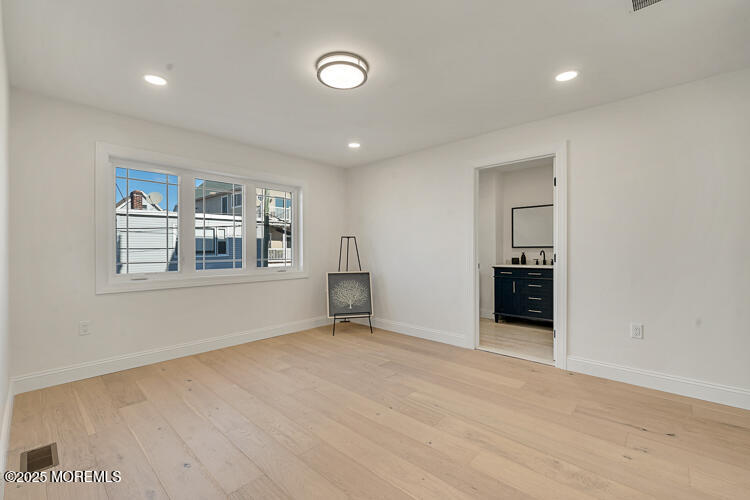24 Surf Street Sea Bright, NJ 07760 - Photo 14 of 47 a view of an empty room with closet and a window