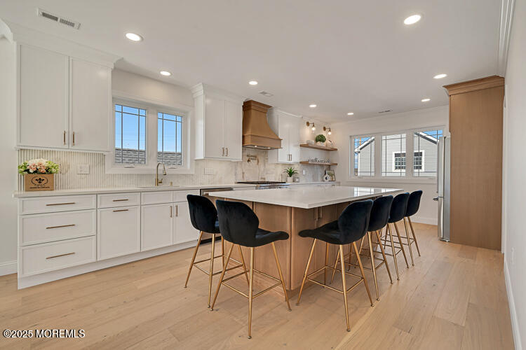 24 Surf Street Sea Bright, NJ 07760 - Photo 3 of 47 a kitchen with a sink and cabinets