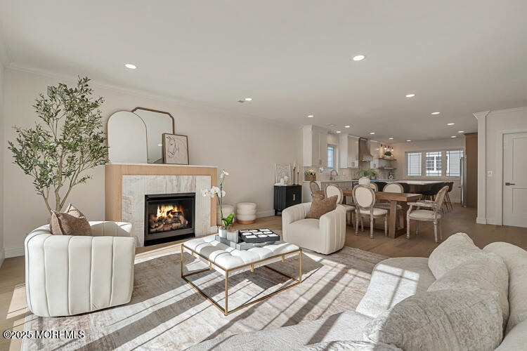 24 Surf Street Sea Bright, NJ 07760 - Photo 9 of 47 a living room with furniture and a fireplace