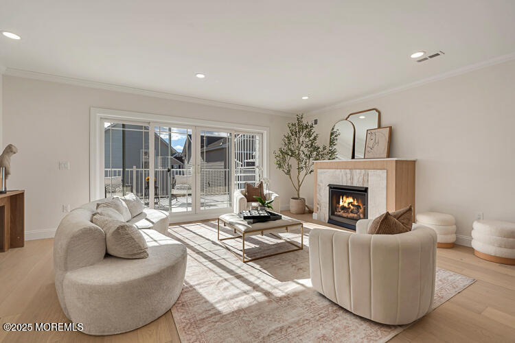 24 Surf Street Sea Bright, NJ 07760 - Photo 10 of 47 a living room with furniture and a fireplace
