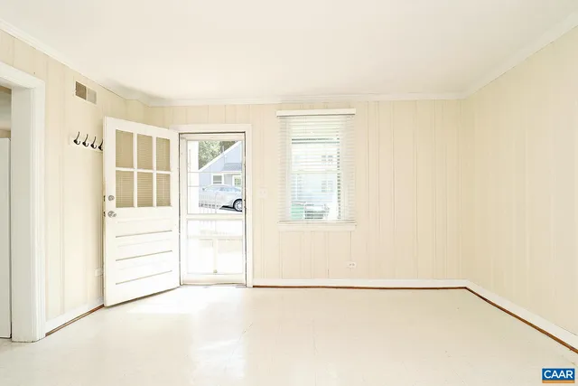 a view of an empty room with a window