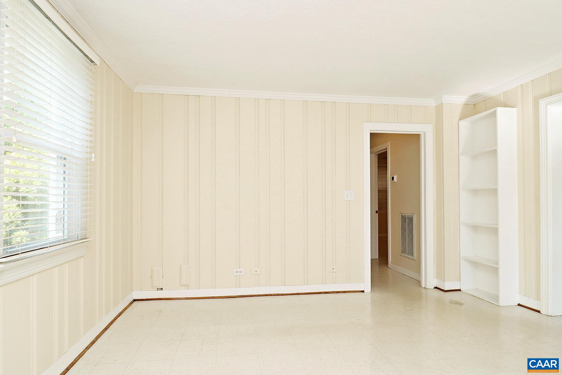 219 Shamrock Road, Unit B Charlottesville, VA 22903 - Photo 3 of 7 a view of an empty room with a window