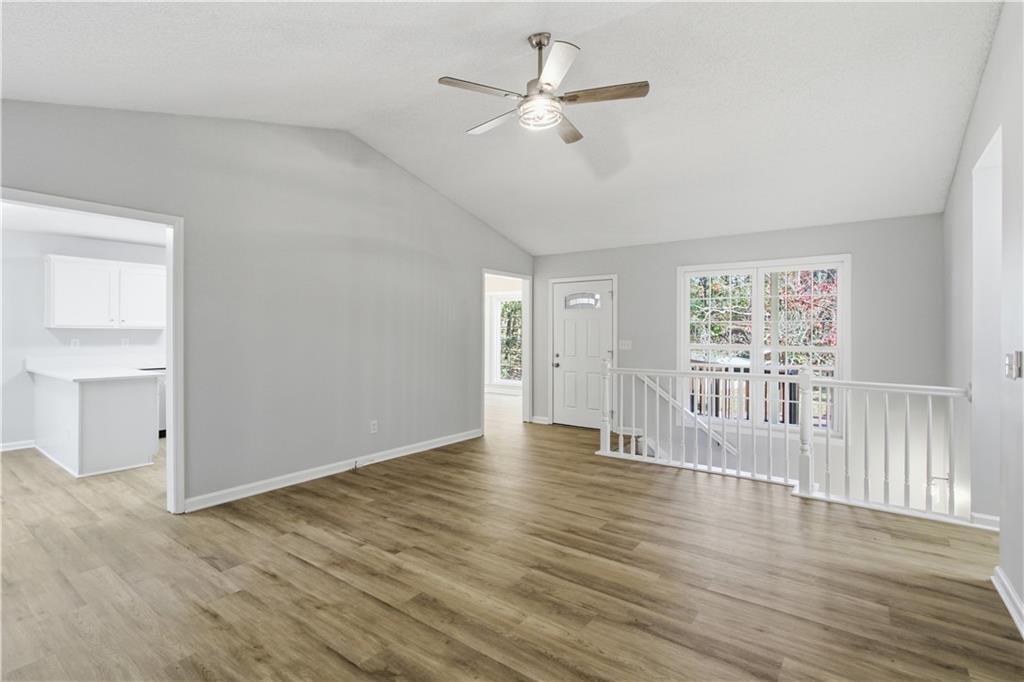 10 Mariner Way Acworth, GA 30102 - Photo 2 of 20 a view of an empty room with wooden floor and a window