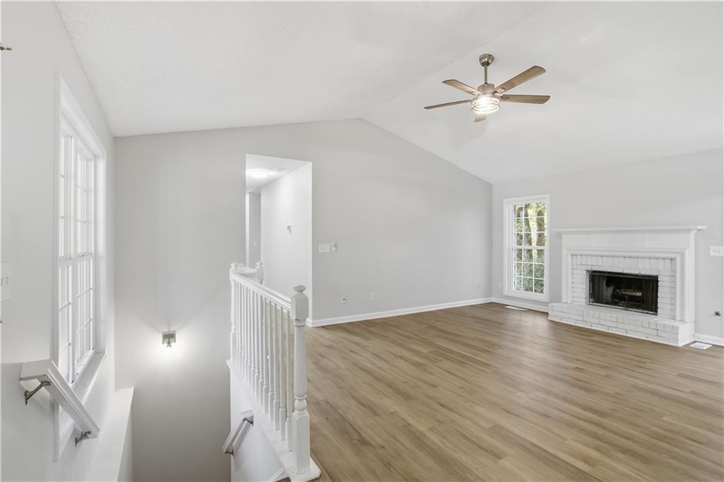 10 Mariner Way Acworth, GA 30102 - Photo 4 of 20 a view of an empty room with chandelier fan and fire place