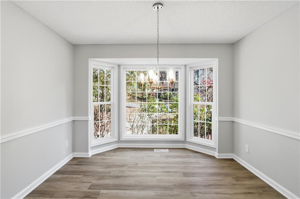 10 Mariner Way Acworth, GA 30102 - Photo 8 of 20 a view of an empty room with wooden floor and a window