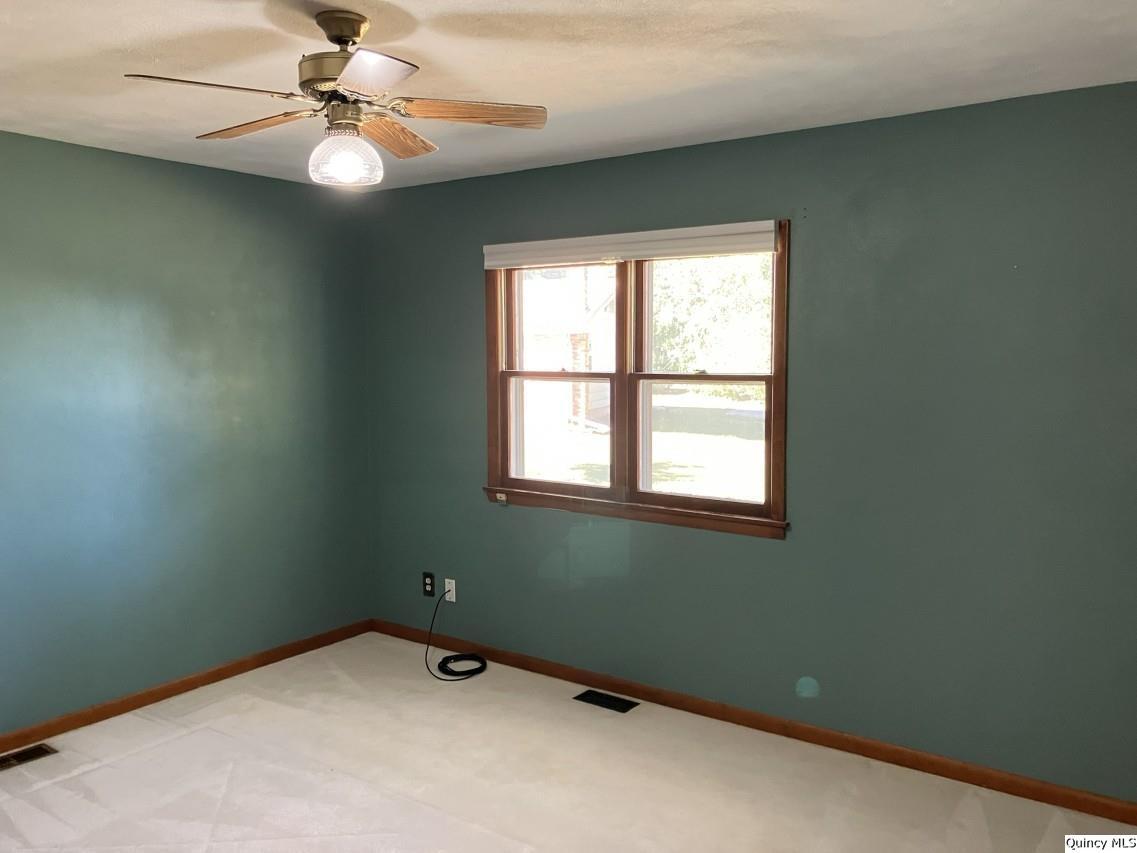 328 North Illinois Street Camp Point, IL 62320 - Photo 11 of 22 an empty room with a window