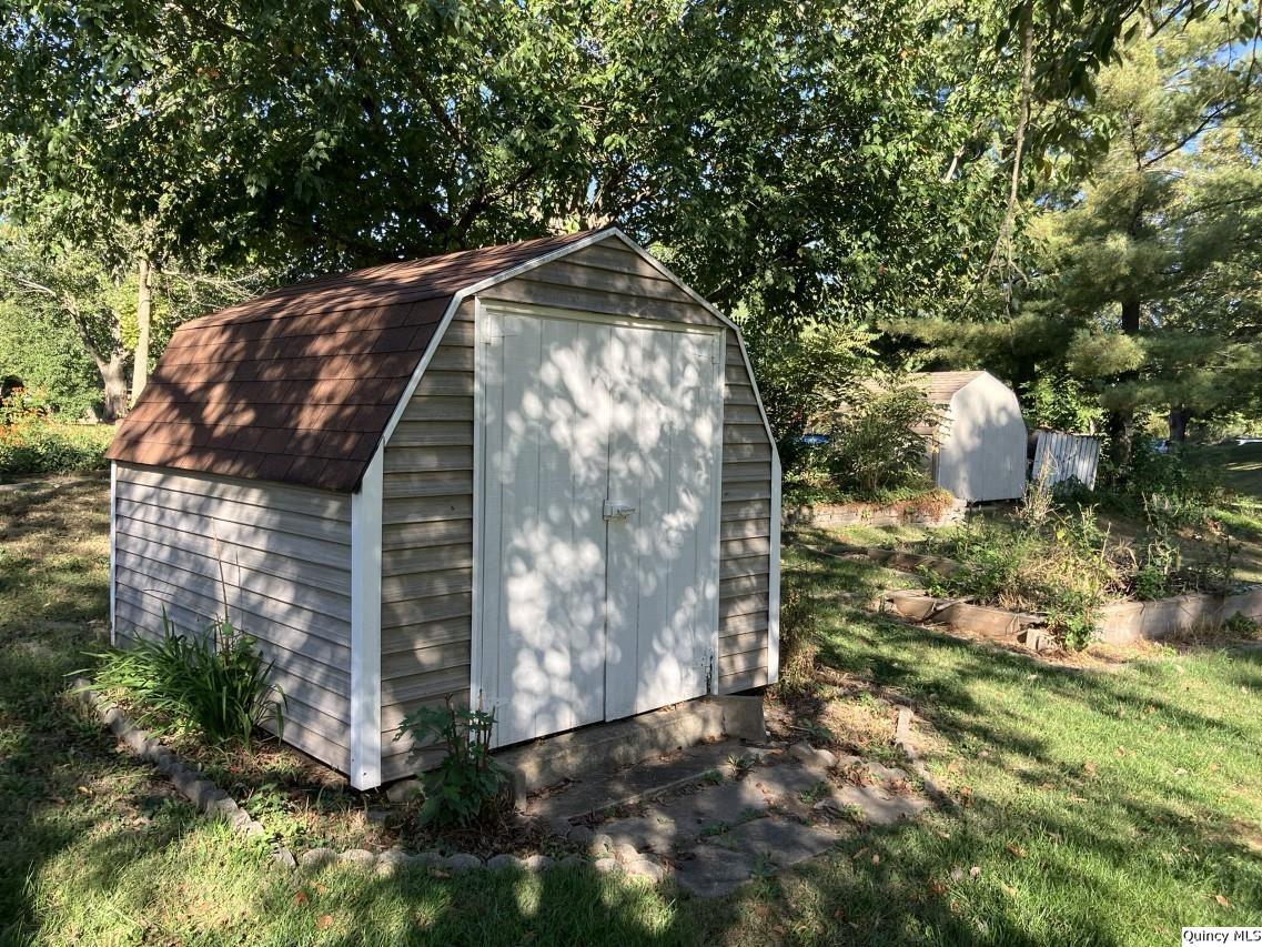 328 North Illinois Street Camp Point, IL 62320 - Photo 19 of 22 a backyard of a house with lots of green space