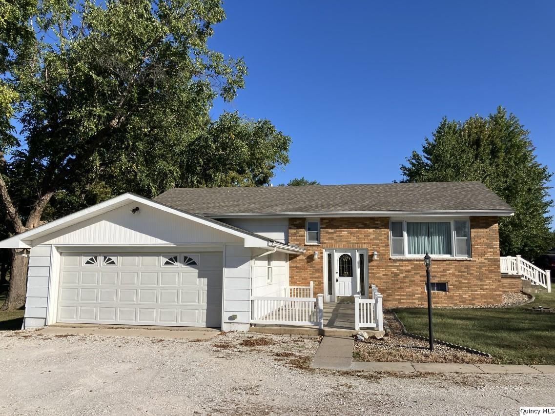 328 North Illinois Street Camp Point, IL 62320 - Photo 2 of 22 a front view of a house with a yard