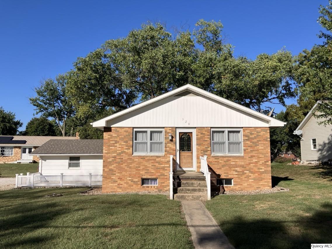 328 North Illinois Street Camp Point, IL 62320 - Photo 22 of 22 a view of a yard in front of a house with large trees