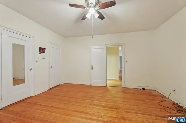 a kitchen with a refrigerator sink and cabinets