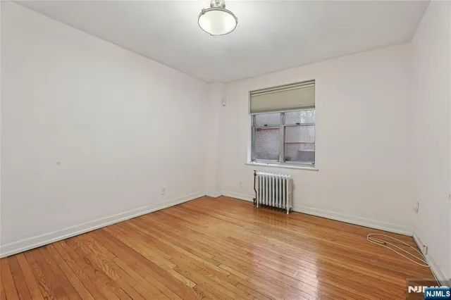 a kitchen with a refrigerator a stove top oven a sink and dishwasher