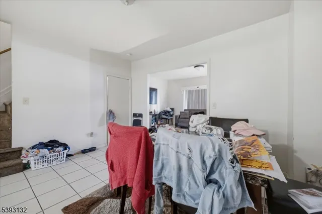 a view of a dining room with furniture and a chandelier