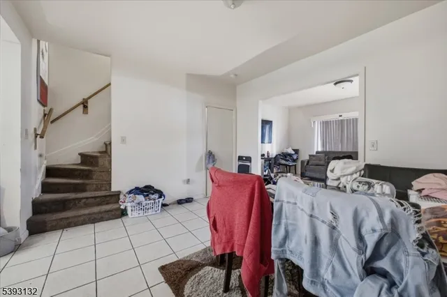 a bed room with two bed and a view of entryway
