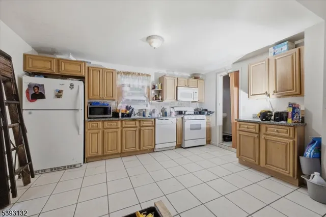 a kitchen with cabinets stainless steel appliances a sink and a counter top space