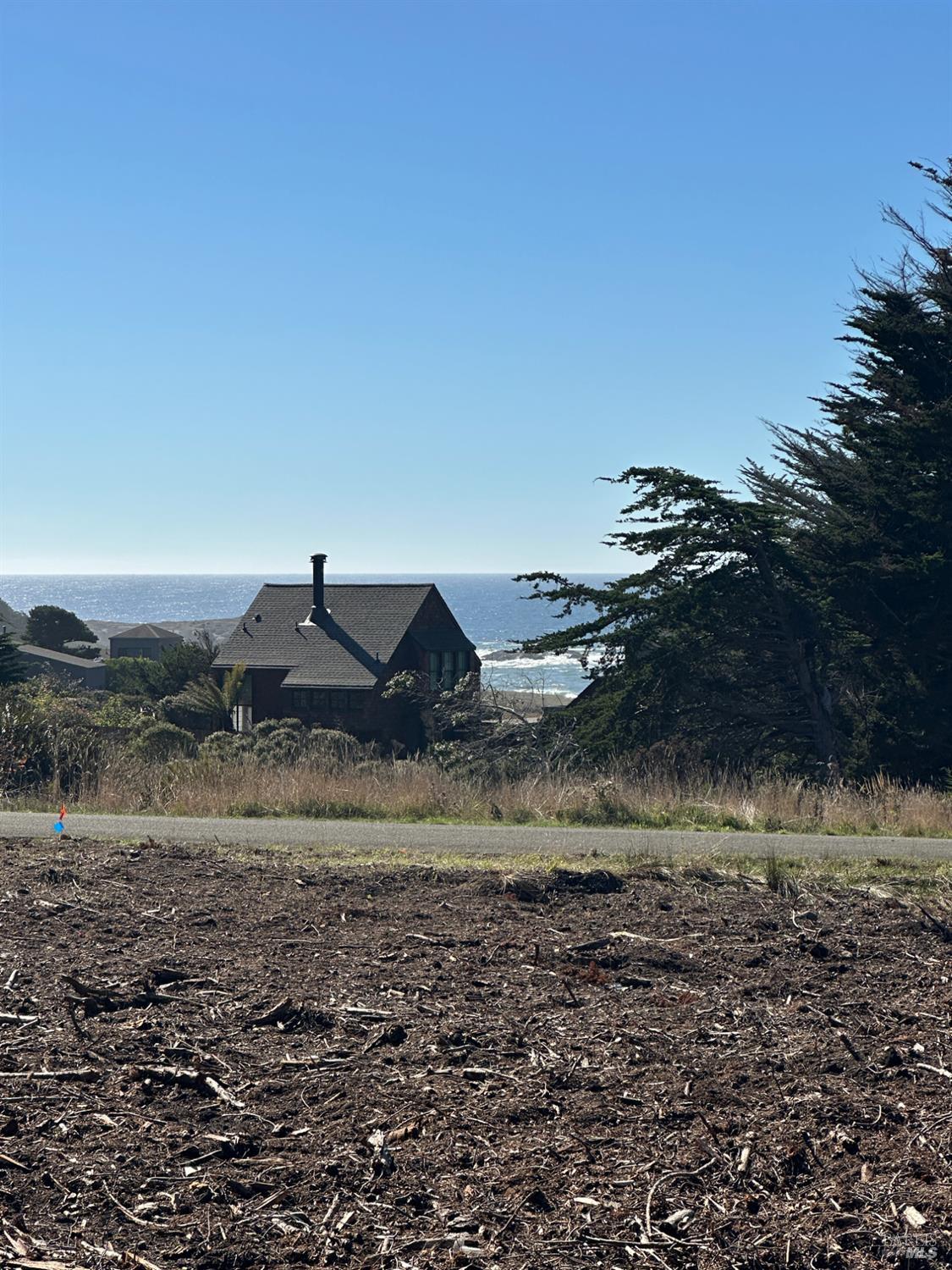 135 Shepherds Close The Sea Ranch, CA 95497 - Photo 20 of 30 a view of a yard with wooden fence
