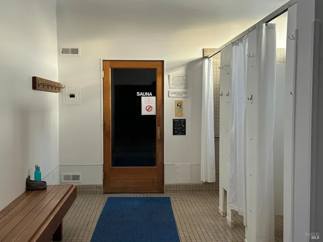 a view of swimming pool with seating area and barbeque oven