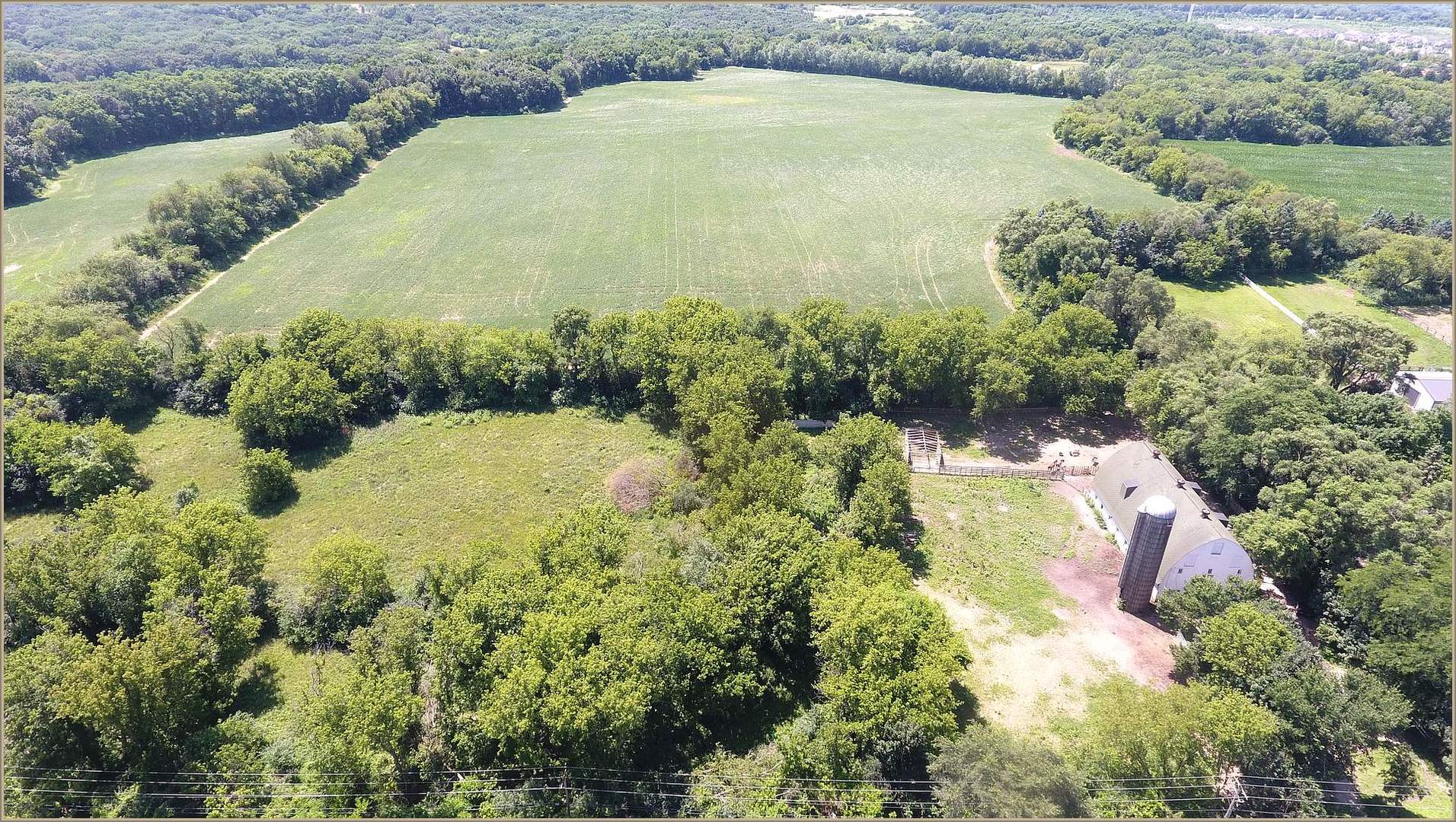 32W683 West County Line Road Barrington Hills, IL 60010 - Photo 1 of 3 a view of a lake with a yard
