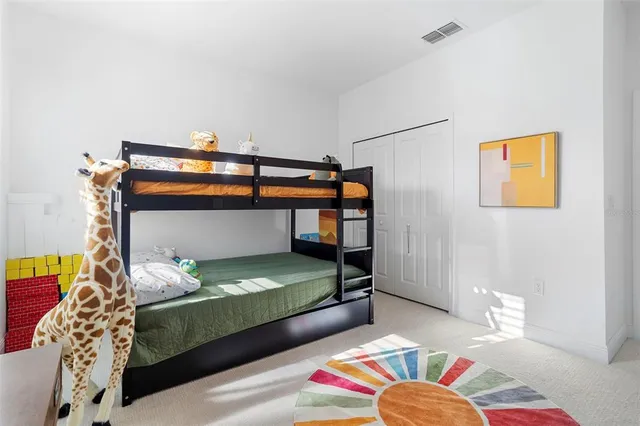 a living room with fish tank and a bookshelf
