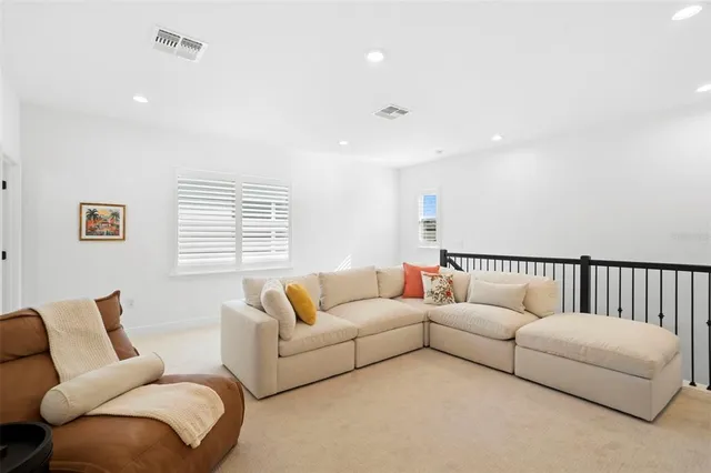 a living room with furniture and a couch