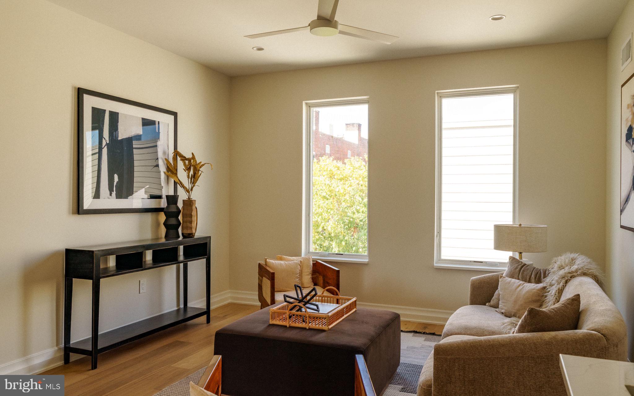 2104 Naudain Street Philadelphia, PA 19146 - Photo 35 of 56 a living room with furniture and two window