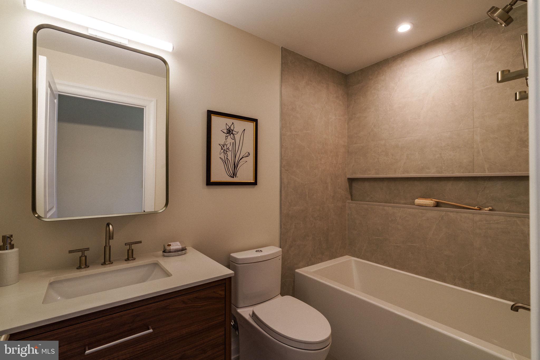 2104 Naudain Street Philadelphia, PA 19146 - Photo 39 of 56 a bathroom with a toilet a sink and bathtub