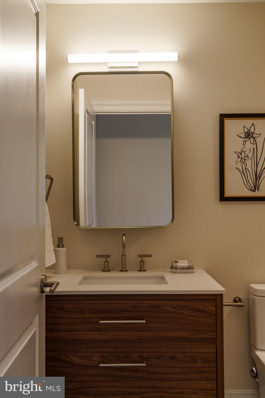 2104 Naudain Street Philadelphia, PA 19146 - Photo 40 of 56 a bathroom with a sink and a mirror