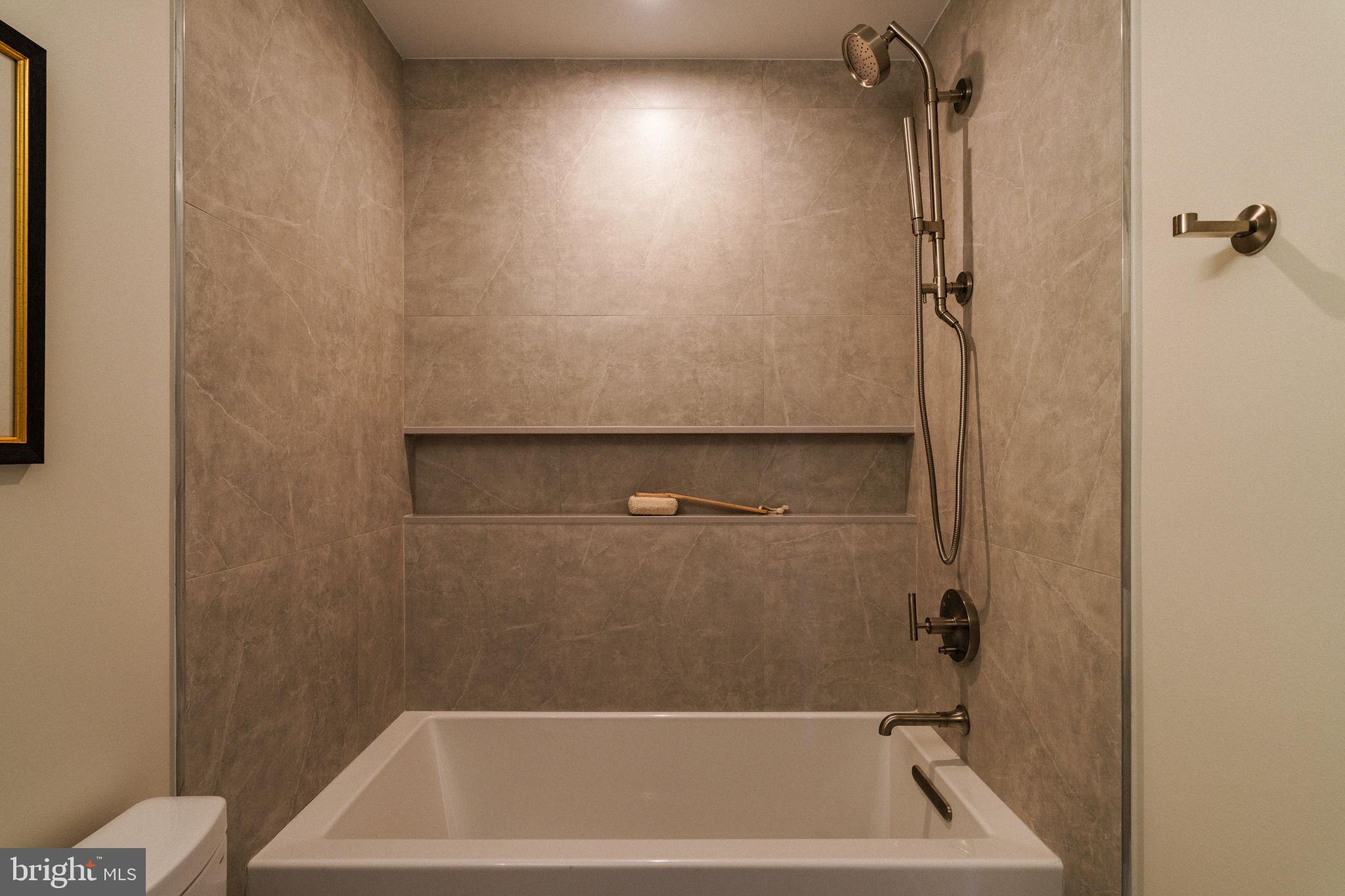 2104 Naudain Street Philadelphia, PA 19146 - Photo 41 of 56 a bathroom with a bathtub