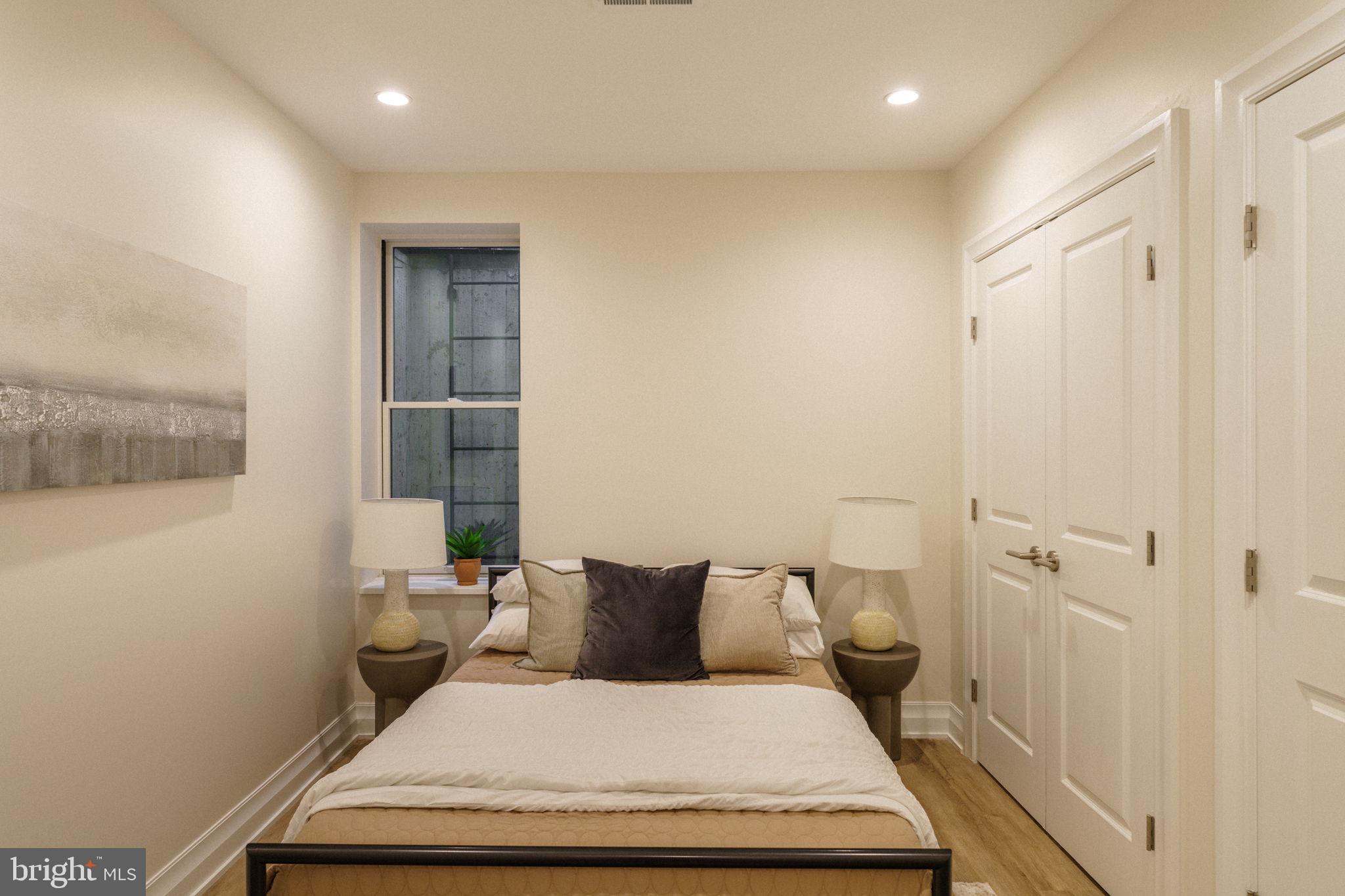 2104 Naudain Street Philadelphia, PA 19146 - Photo 43 of 56 a bedroom with a bed and wooden floor