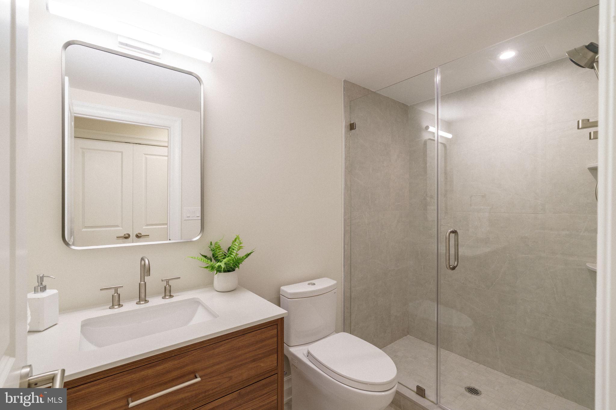 2104 Naudain Street Philadelphia, PA 19146 - Photo 44 of 56 a bathroom with a sink a toilet and shower